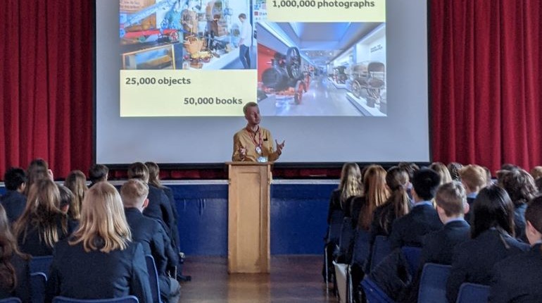 MERL staff member speaking at an assembly about careers in heritage