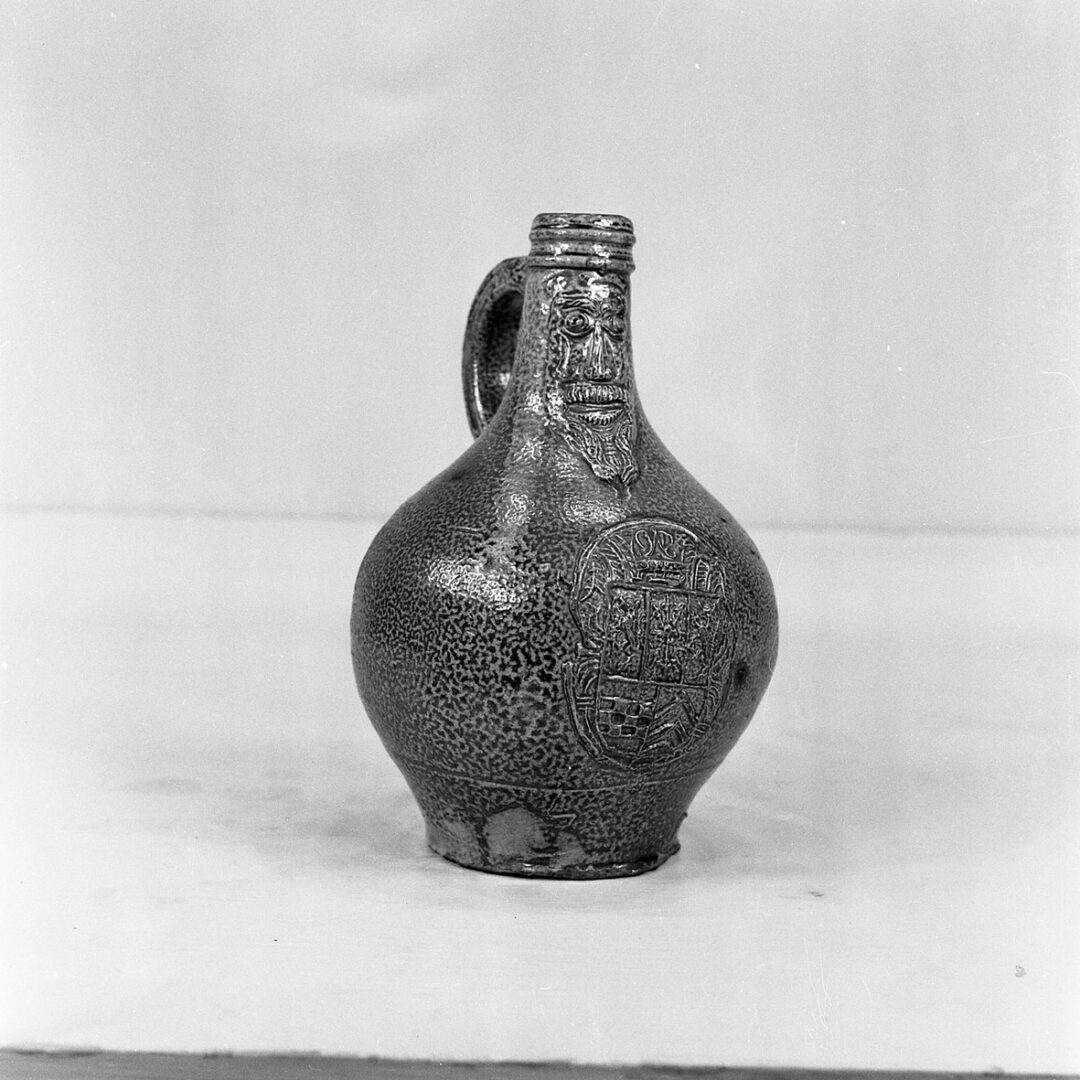 Jug (object name) This saltglazed pottery jug was known as a Greybeard. (MERL 55/675)