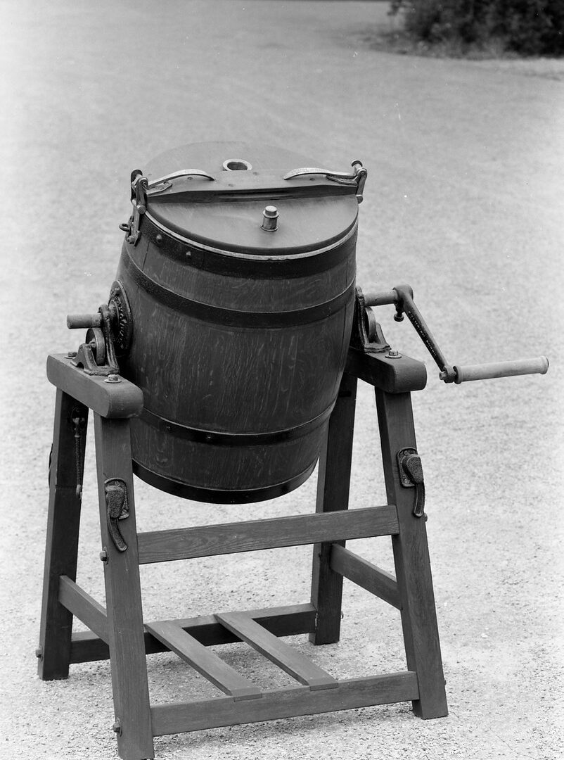 Churn, butter (object name) This butter churn was used for making butter, and is of a type generally used in larger dairies. It is inscribed: 'Champion churn used by the champion butter makers of England and Scotland'. (MERL 56/359)