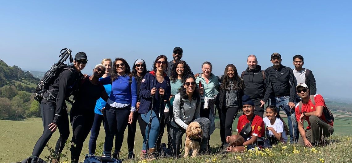 Members of the Dadima's walking group standing in a field